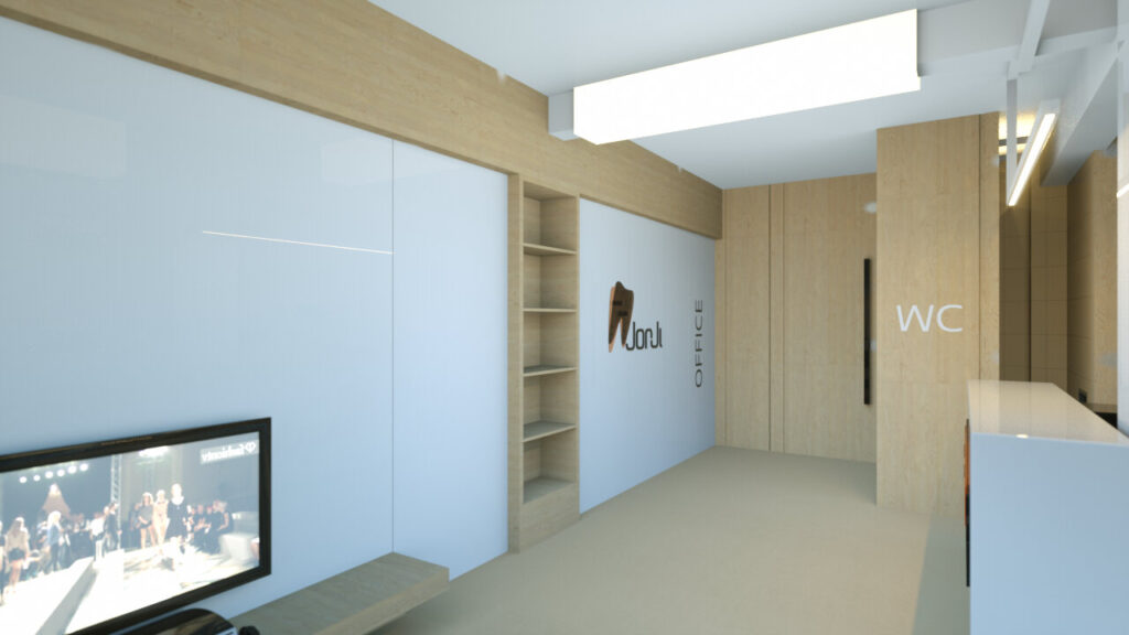 A bright, modern dental office reception area with white walls, light wood accents, and built-in storage. A television is visible on the left, and signage indicates "OFFICE" and "WC" (water closet/restroom). The reception desk is partially visible on the right, featuring a white countertop. The overall design is clean and minimalist, creating a welcoming and professional atmosphere. By Modify Architects